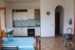 THE LIVING ROOM AND THE KITCHEN